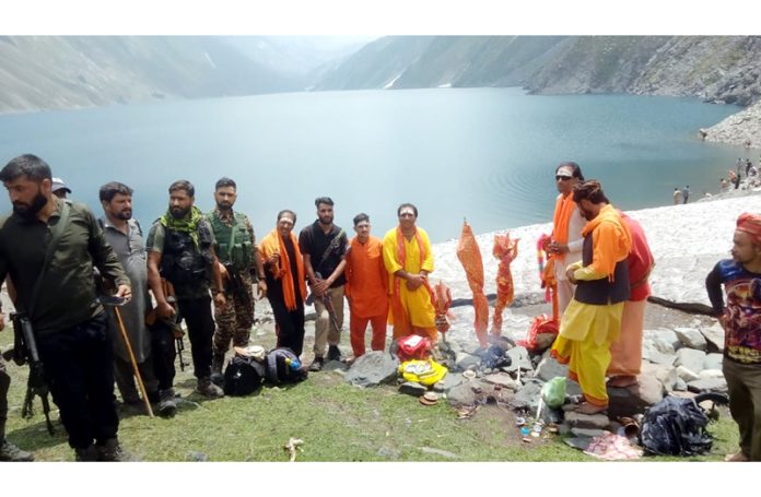 Puja of holy mace being performed on the shore of lake during Kounsar Nag Yatra. -Excelsior/Romesh Mengi