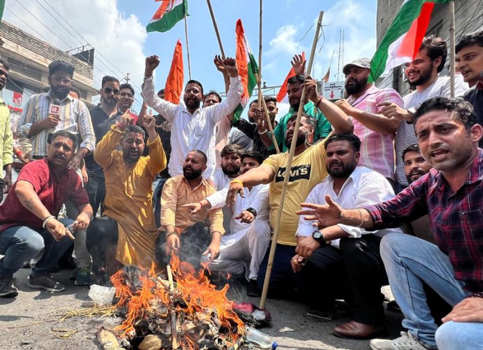 BJYM activists burning the effigy of Dr Farooq Abdullah in Jammu on Tuesday.