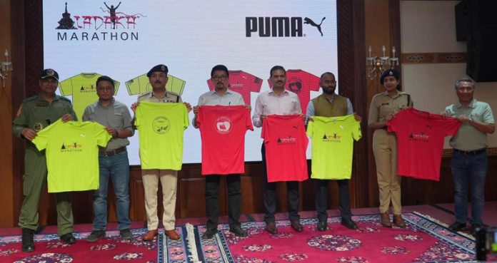 Dignitaries unveiling official jersey of Ladakh marathon.