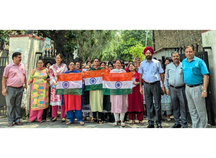 Students of SPMR College alongwith Principal and staff during an event.