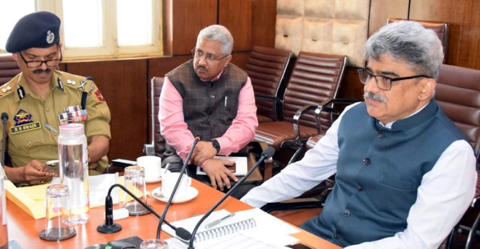 Chief Secretary chairing a meeting.