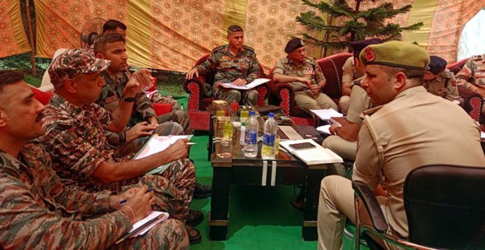 ADGP Jammu, Anand Jain, chairing a meeting at Chassana area of Reasi District on Monday.