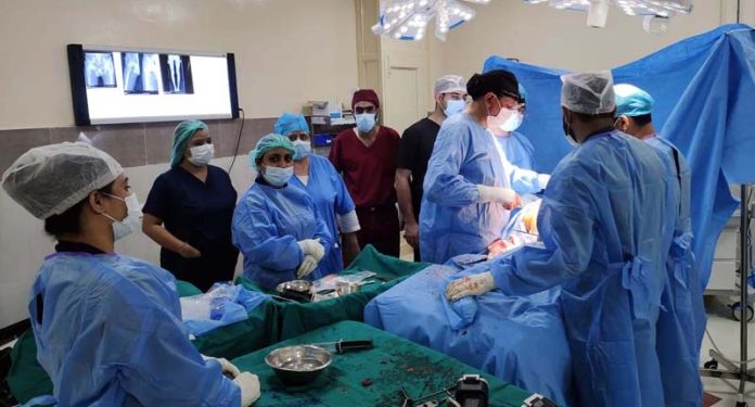 A team of doctors performing a procedure on a patient at Bone and Joint Hospital, Jammu on Thursday.