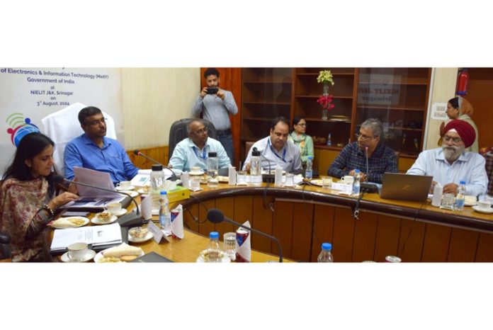 Union Secretary chairing a meeting.