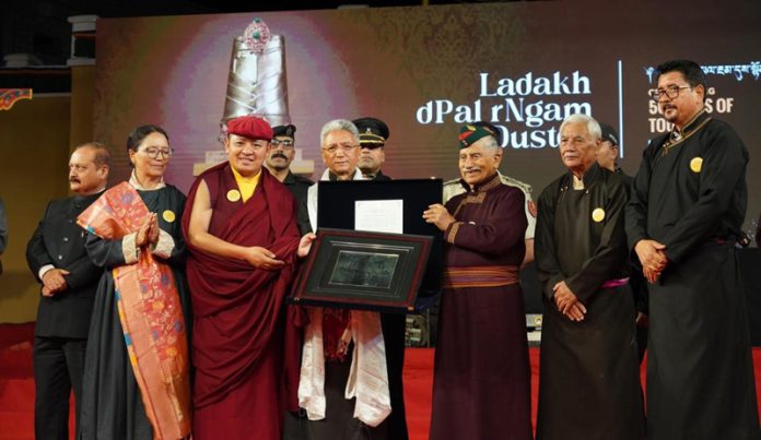 LG Ladakh, Brig (Retd) BD Mishra, honouring a dignitary in Leh on Tuesday.