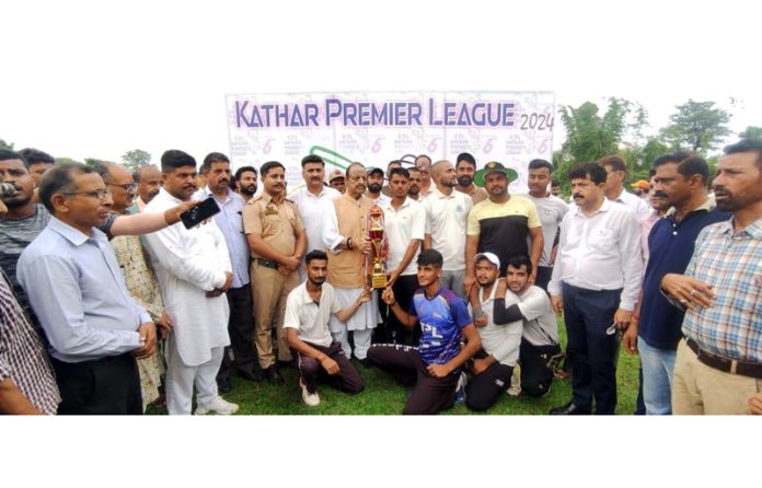 Senior BJP leader Devender Singh Rana posing for a group photograph with winner-up team on Sunday.