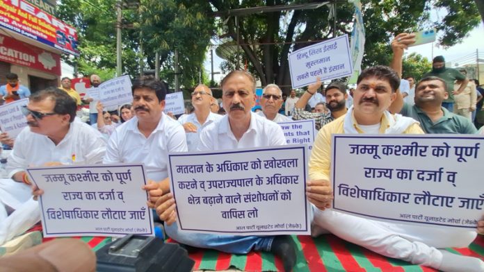 Leaders raising slogans at all-party meeting in Kathua on Thursday.