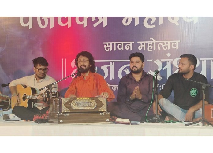 Renowned singer Dev Dildar performing at Panjvaktra Mandir in Jammu on Monday.