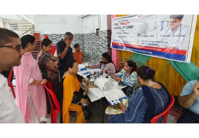 Doctors examining patients at Rehari Colony on Sunday.