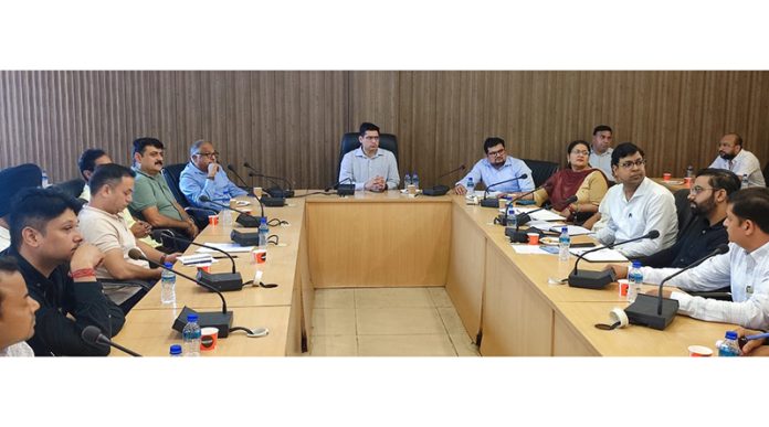 MD JPDCL Vikas Kundal chairing a meeting on Friday.