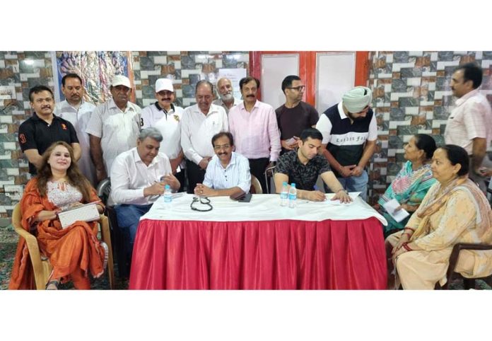 Doctors giving free consultation to the patients during a medical camp in Jammu on Sunday.