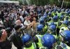 100 arrested as far-right anti-immigrant violent clashes spread across UK