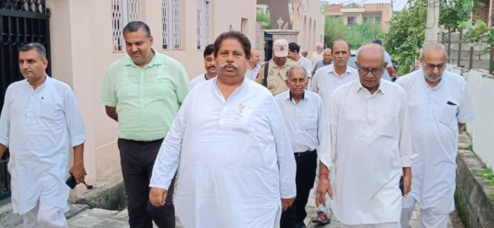 JKPCC working president Raman Bhalla posing along with party workers after a meeting in Jammu South constituency.