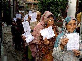 Women voters outside a Polling Station in Srinagar on Wednesday. -Excelsior/Shakeel