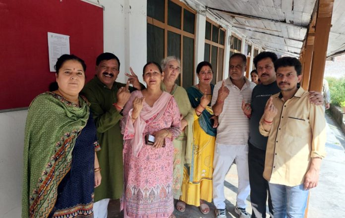 A group of voters posing together after casting their votes in Poonch-Haveli constituency. -Excelsior/Ramesh Bali