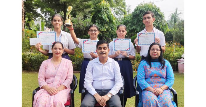 Students of BSF School posing along with staff.