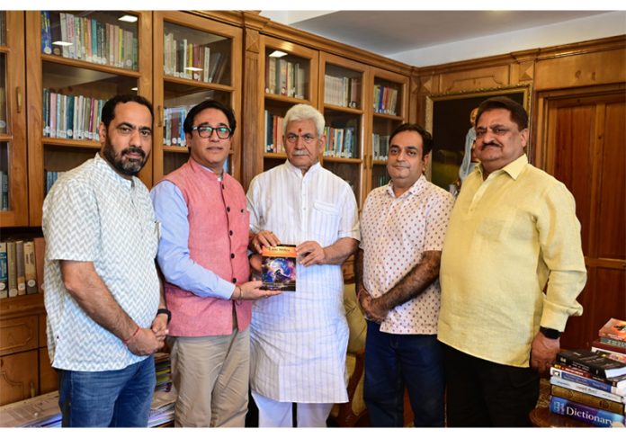 Lt Governor, Manoj Sinha releasing the book of Raj Nehru, VC Skill University, Palwal Haryana at Raj Bhawan Srinagar in presence of prominent citizens.