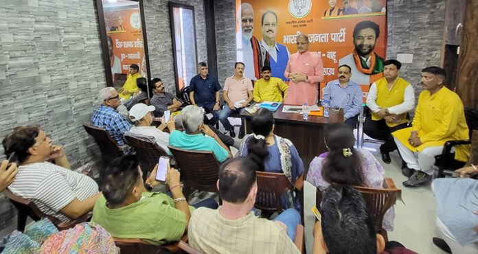 Senior BJP leader Kavinder Gupta addressing a meeting of Trikuta Mandal at Party Headquarters, Jammu.