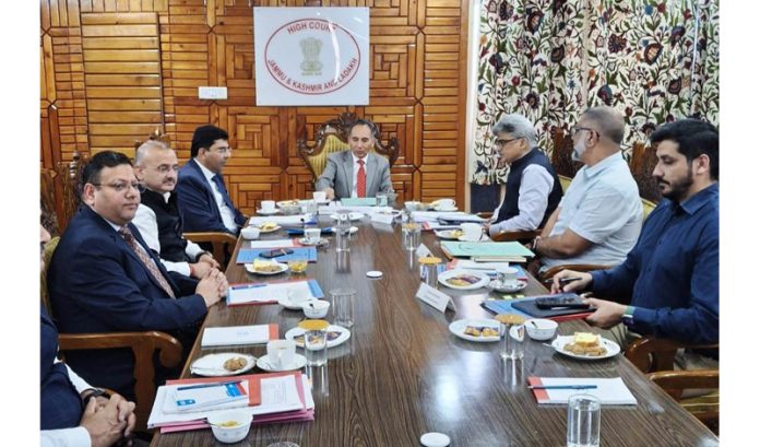 Chief Justice Tashi Rabstan along with CS Atal Dulloo and other officers during a meeting on Monday.