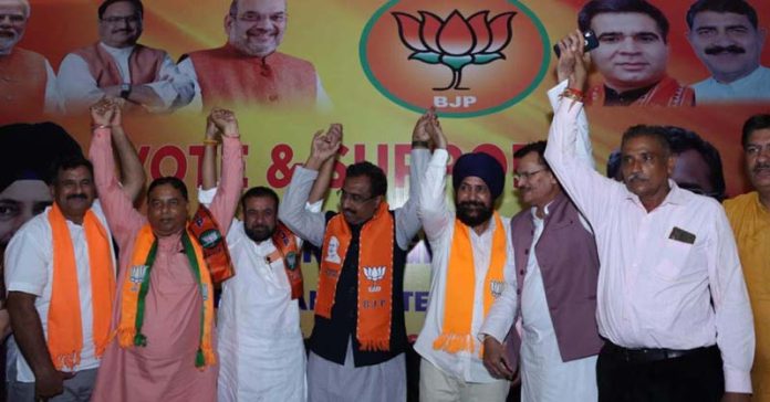 BJP senior leader Ram Madhav at an election rally with party leaders at RS Pura on Tuesday.