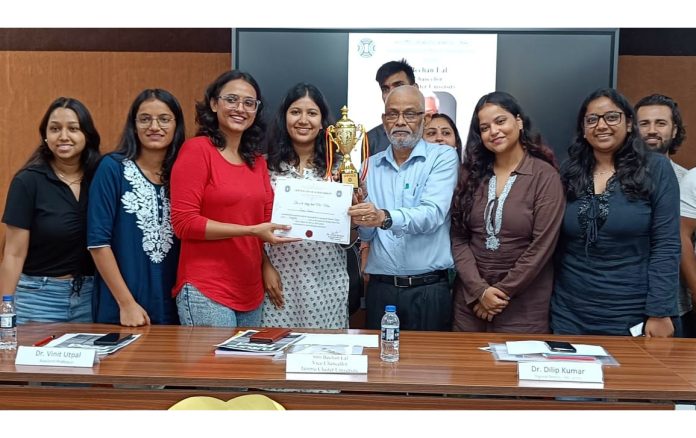 Bechan Lal, VC of the Jammu Cluster University receiving a memento during a function in Jammu on Wednesday.