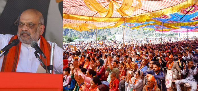 Union Home Minister Amit Shah addressing a rally at Paddar on Monday. - Excelsior/Tilak Raj