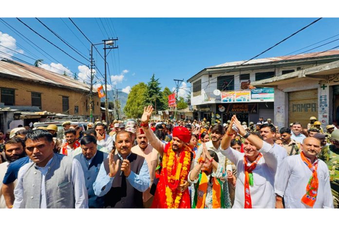 BJP MP and former Union Minister Anurag Thakur participating in a road show at Paddar in support of BJP candidate Sunil Sharma on Thursday. — Excelsior/Tilak Raj