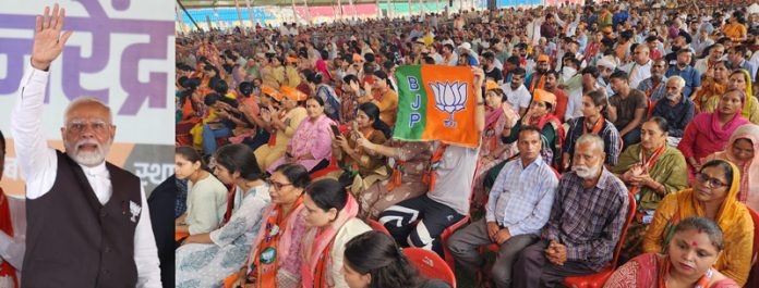 PM Narendra Modi waving to people during rally at MA Stadium in Jammu on Saturday. - Excelsior/Rakesh