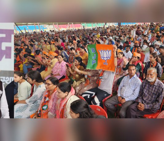 PM Narendra Modi waving to people during rally at MA Stadium in Jammu on Saturday. - Excelsior/Rakesh