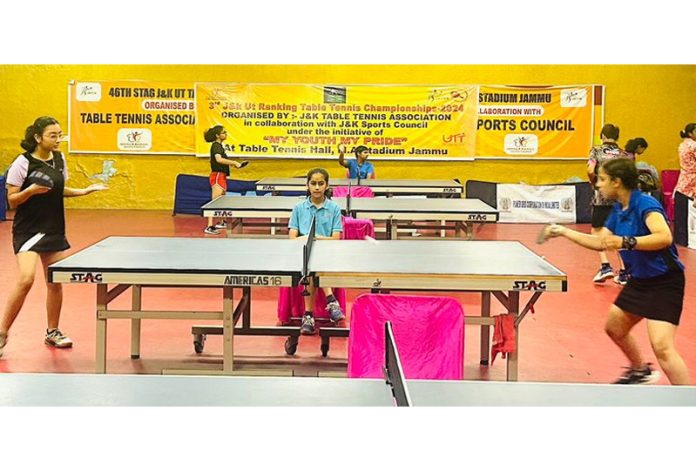 Table Tennis players in action during a match at MA Stadium Jammu.