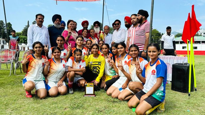 Winning team posing along with trophy at Poonch.