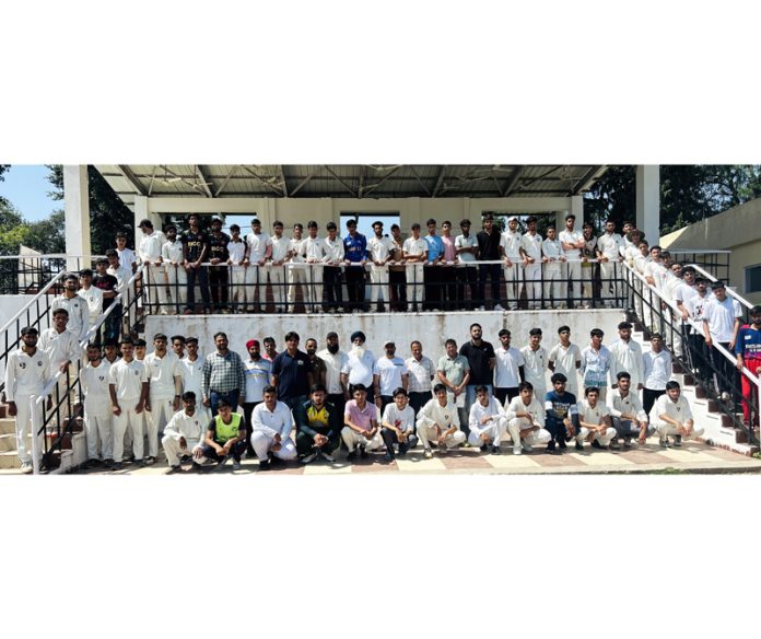 Under-19 boys posing during District Cricket selection trials at Poonch.