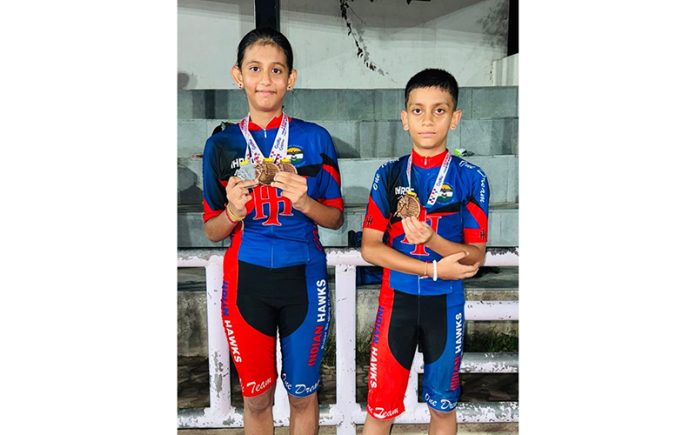 J&K Skaters, Adhira Kanotra and Adwait Sharma posing with medals during Legends Cup.