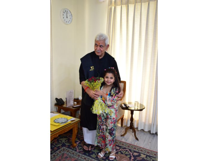 Mahira Tondon, a 5-year-old from Jammu visits Lieutenant Governor Manoj Sinha after winning the International Star Award and the Youngest Influencer Award in Delhi. LG Sinha praised Mahira for her achievements and extended his best wishes for her future success.