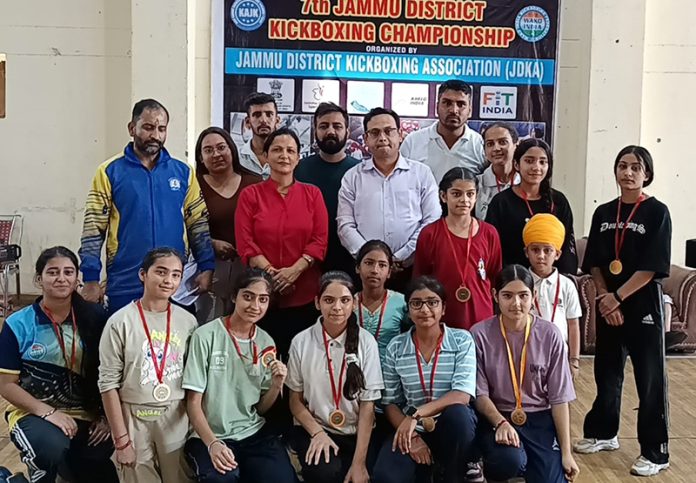 Boxers posing along with organizing members during award ceremony.