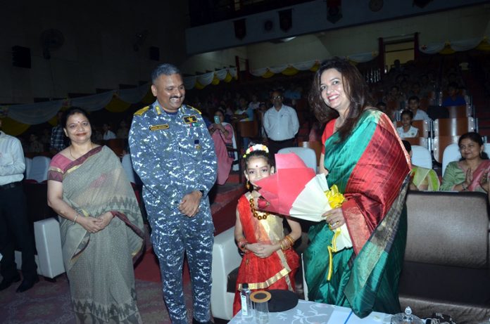 Zonal Vice President of AWWA Dr Namita Singh receiving a bouquet during a programme.