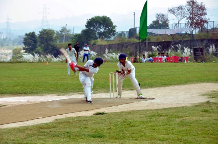 Players in action during a cricket match at Khel Gaon, Nagrota.