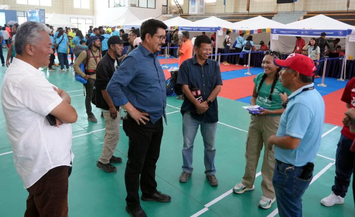 Officials interacting during inaugural event of Ladakh Marathon 2024 expo.