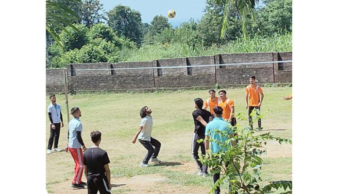 Players in action during a Volleyball game.