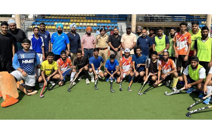 Selected Jammu & Kashmir Junior National Hockey Team posing along with DIG Jammu, Shiv Kumar Sharma and others.