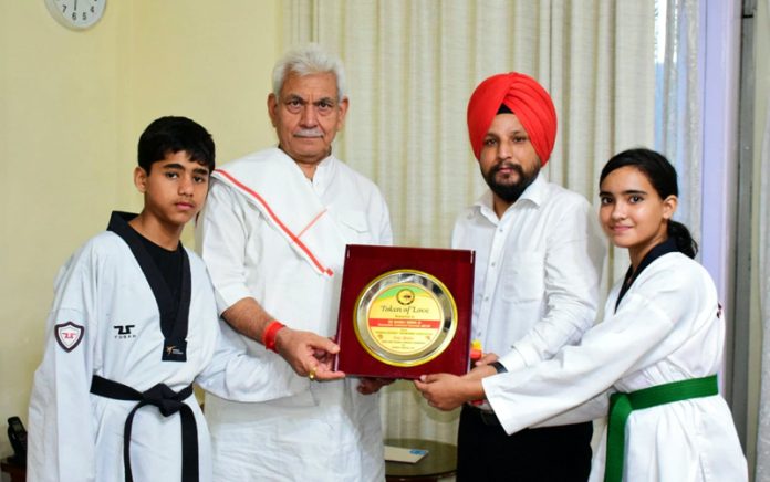 Lieutenant Governor Manoj Sinha today met Mohd Arhaan and Aarohi Dutta, Sub Junior National Taekwondo Silver and Bronze medalists at Raj Bhawan in Jammu. They were accompanied by their Coach Rajinder Singh. The Lt Governor congratulated and extended his best wishes to the young players hailing from Poonch district.