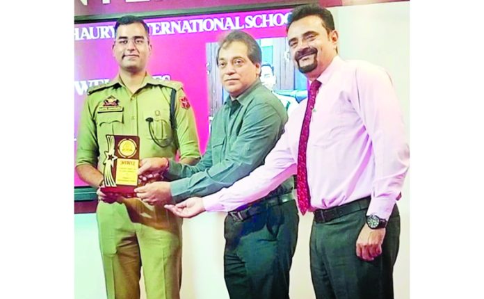 SDPO Jammu South, Kartik Shrotriya, receiving a memento from management of SIC Jammu.