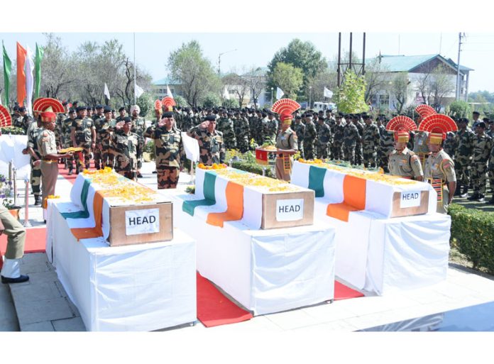 A wreath laying ceremony of BSF jawans who lost their lives yesterday in Budgam road accident at Humhama on Saturday.(UNI)