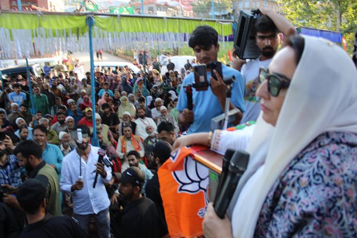 BJP national executive member, Dr Darakhshan Andrabi addressing a political function in Rajpora Assembly constituency on Thursday.