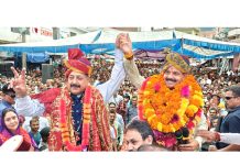 Union Minister Dr Jitendra Singh with BJP candidate Balwant Singh Mankotia during public rally at Chenani on Wednesday.