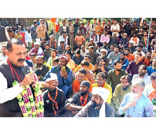 Union Minister Dr Jitendra addressing a BJP election public meeting in remote Chhatru area of Inderwal Assembly constituency on Friday.