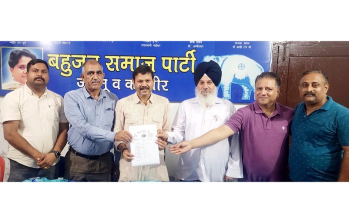 BSP leaders displaying the list of candidates for second and third phase of Assembly elections at Jammu on Wednesday.