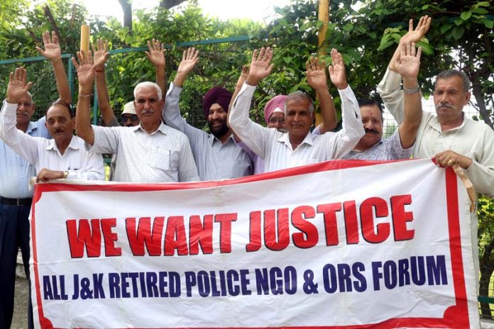 Retired personnel of J&K Police staging a protest near Hari Singh Park in Jammu.-Excelsior/Rakesh