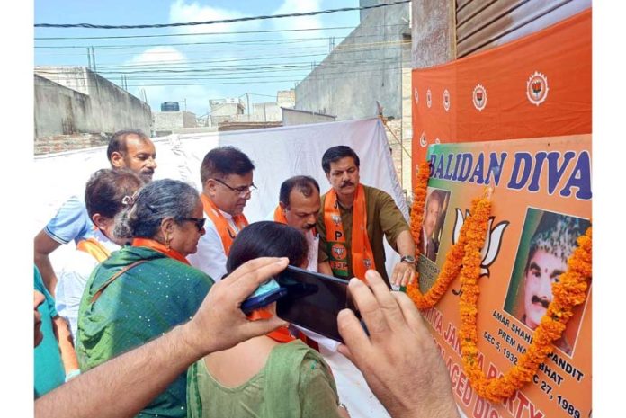 BJP leaders paying tribute to Tika Lal Taploo at Durga Nagar on Friday.