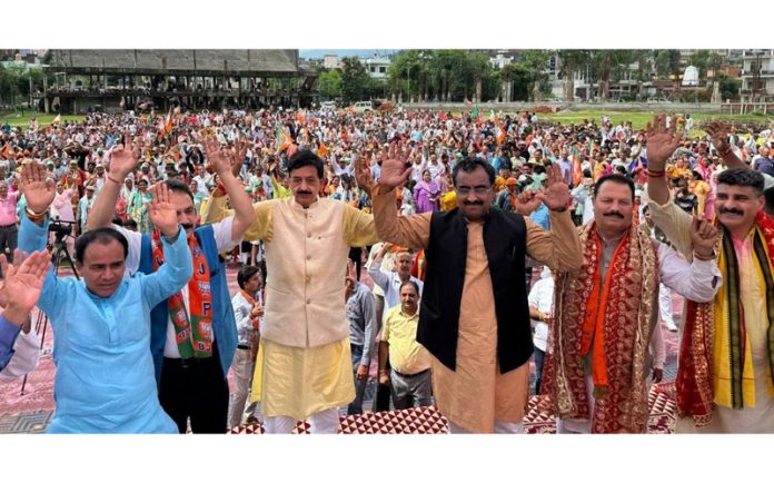 BJP's Udhampur West candidate, Pawan Kumar Gupta, with Ram Madhav and other senior BJP leaders at a rally in Subash Stadium.